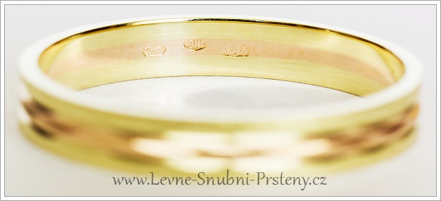 Puncy ryzosti uvnitř snubního prstene z kombinovaného zlata